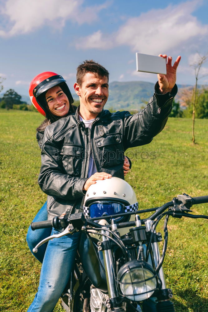 Similar – Couple taking a selfie on the motorcycle