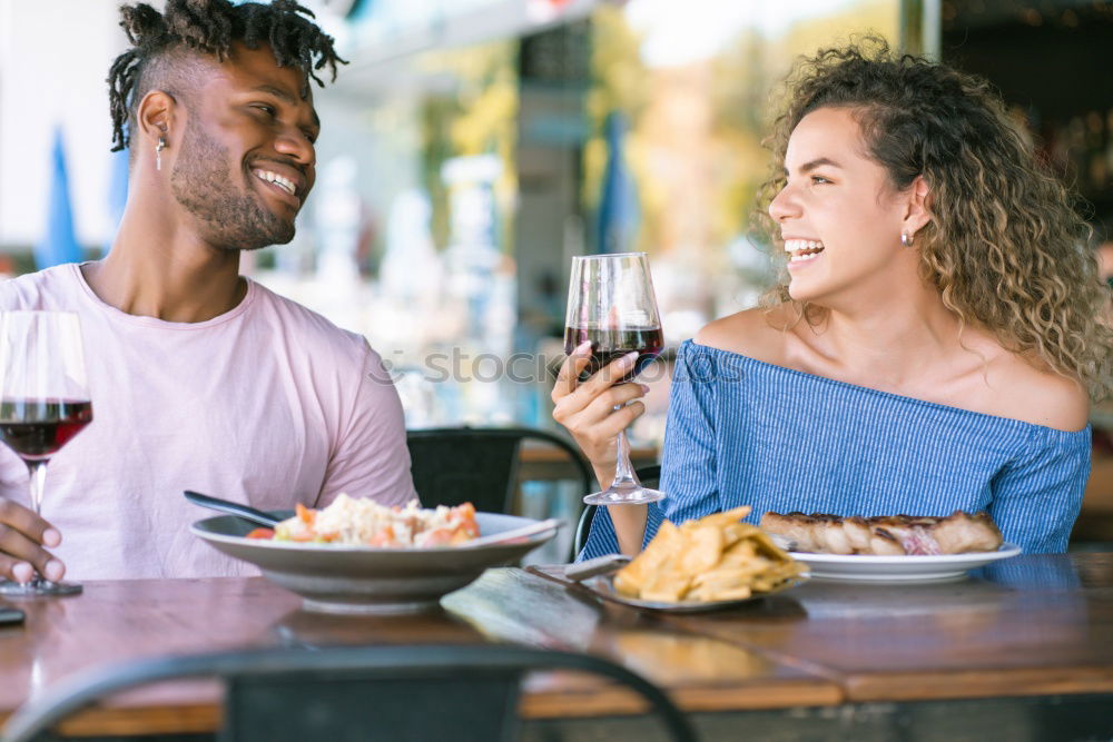 Similar – Cute young adult couple taking photo at outdoor picnic