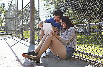 Similar – Image, Stock Photo Young couple walking through the city