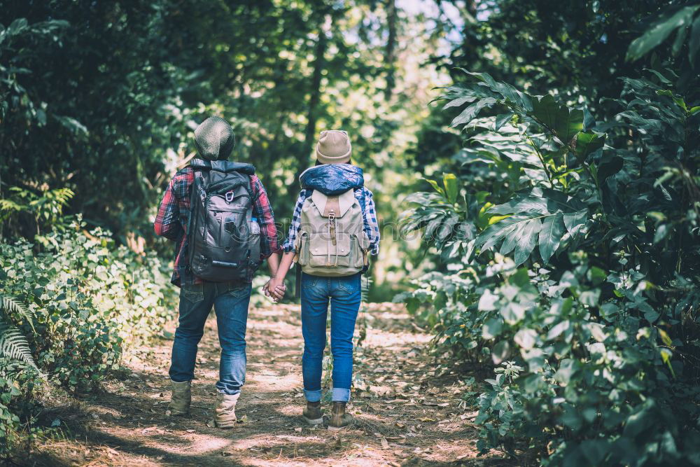 Similar – Image, Stock Photo Couple of hikers doing trekking