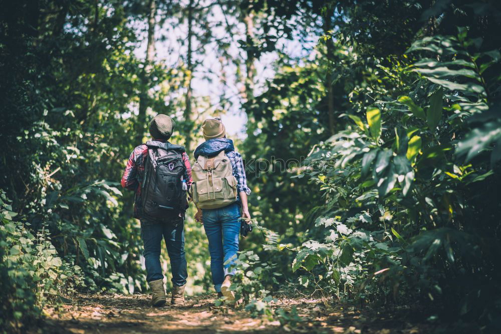 Similar – Image, Stock Photo Couple of hikers doing trekking