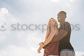 Similar – Image, Stock Photo Smiling young woman and man sitting on a pier over the sea