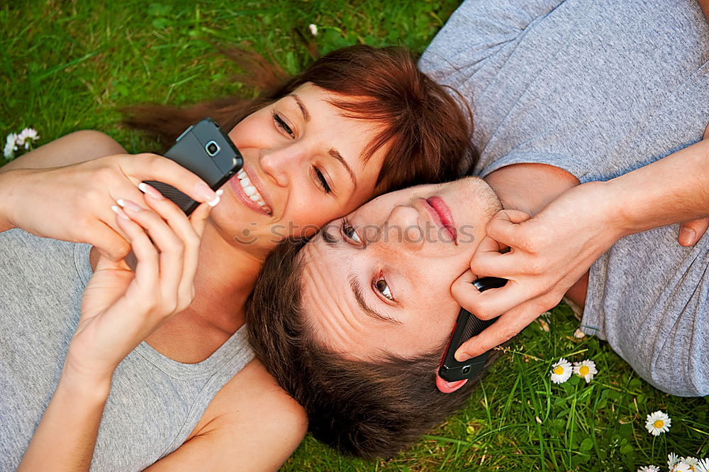 Similar – Image, Stock Photo a couple of teenagers lying in the grass