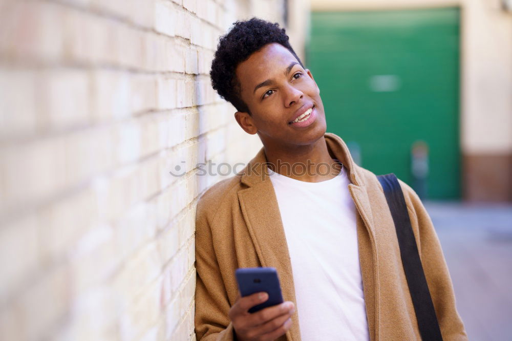 Similar – Image, Stock Photo Young black man using smart phone outdoors