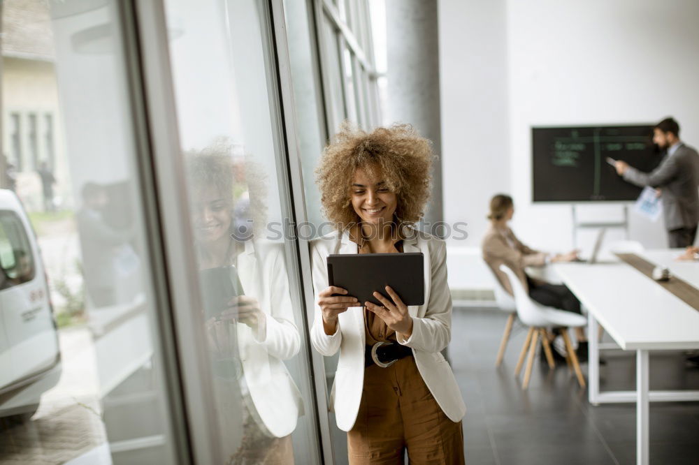 Similar – Beautiful afro american woman using mobile and laptop in the coffee shop.