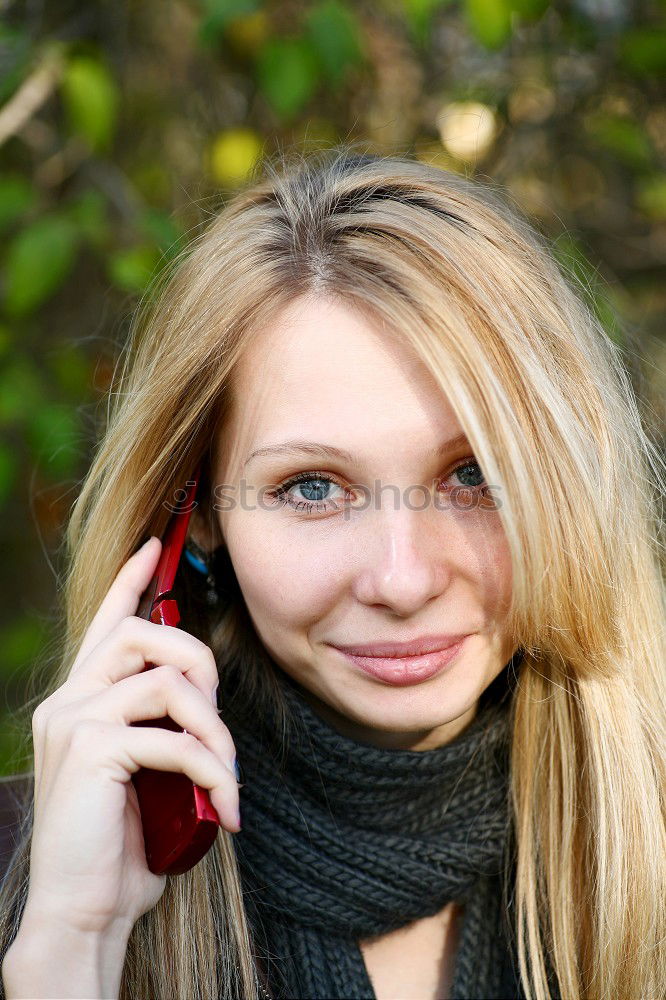 Similar – Smiling Woman in Autumn Fashion Talking on Phone