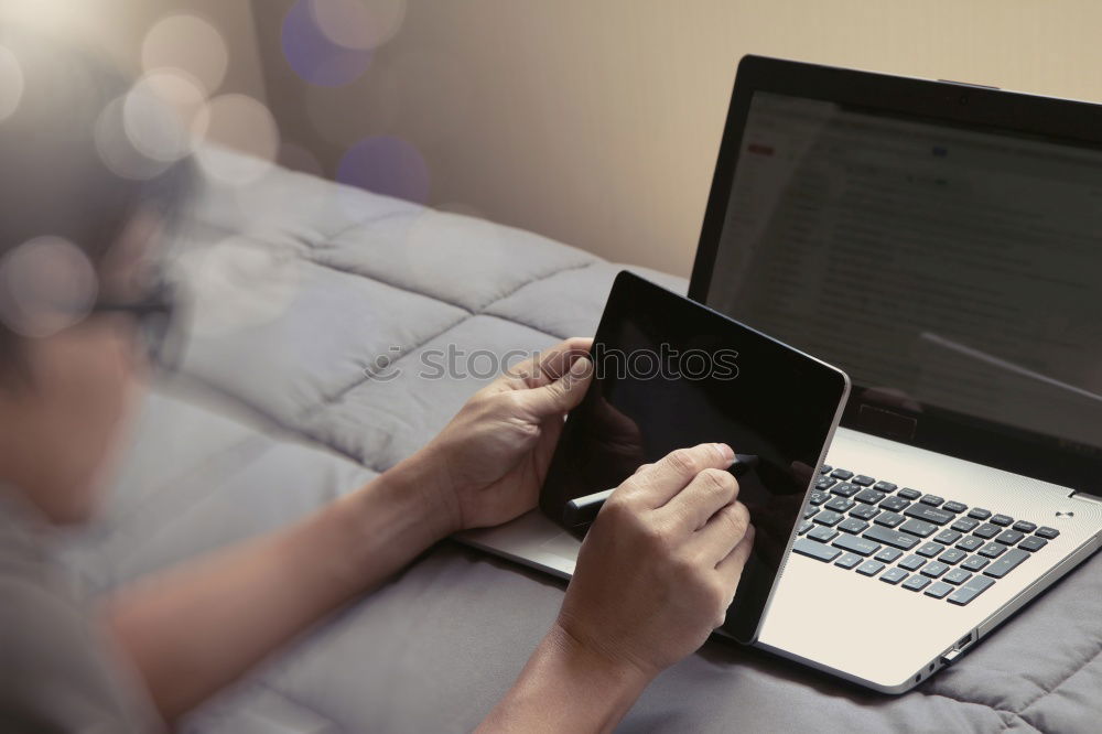 Similar – Young man writing in notebook