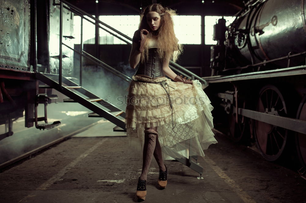 Similar – Girl waiting train on the platform of railway station