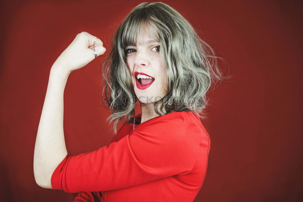 Similar – Image, Stock Photo Young expressive woman in a classic feminist image