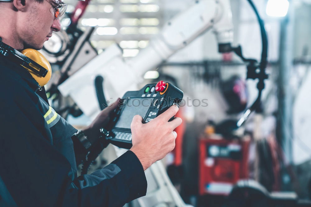 Similar – Man putting part on bike