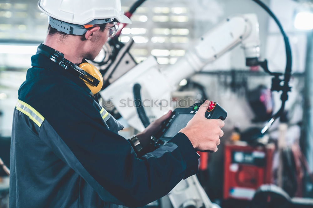 Similar – Image, Stock Photo Professional Mechanic Repairing Car.