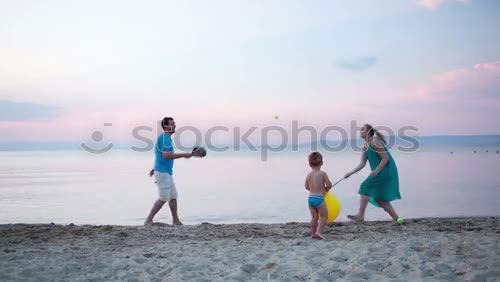 Similar – Image, Stock Photo Mother and son walking on the beach together