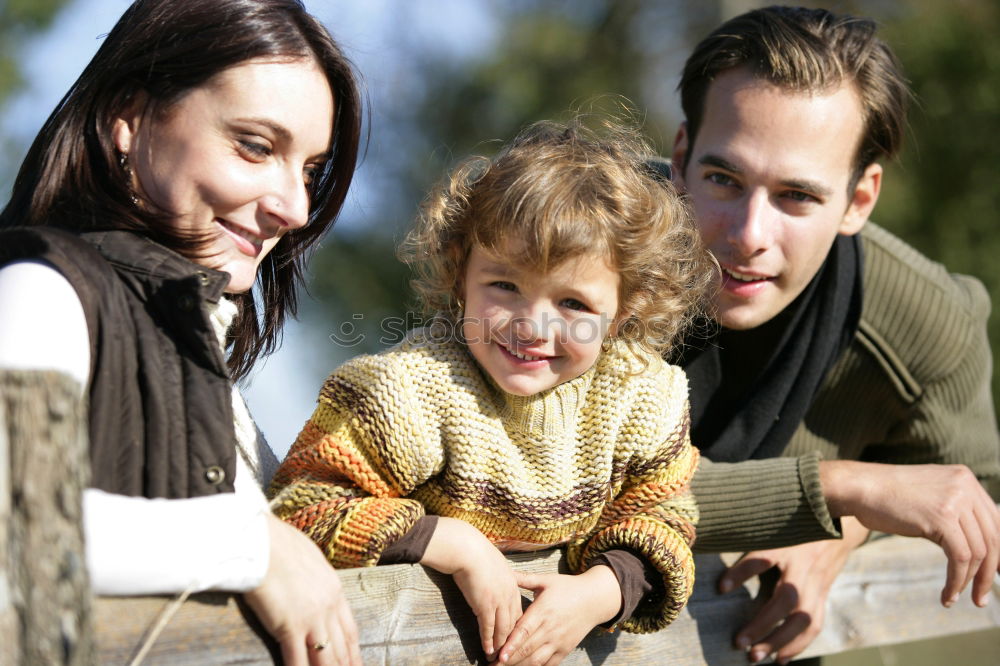 Similar – Image, Stock Photo Happy young family in a urban park.