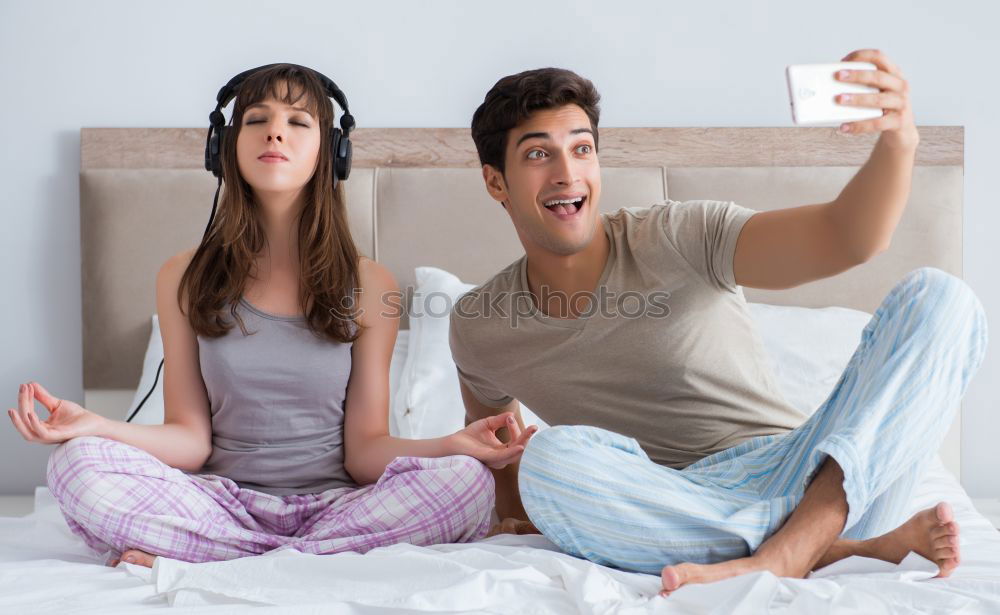 Similar – Image, Stock Photo Top shot of brother and sister listening to music together from smartphones