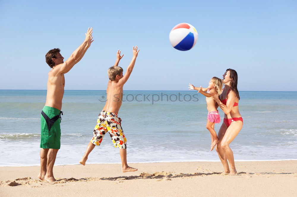 Similar – Image, Stock Photo Mother, father and little son on summer vacation at the seaside, They wearing snorkels and flippers while lying and playing on the beach