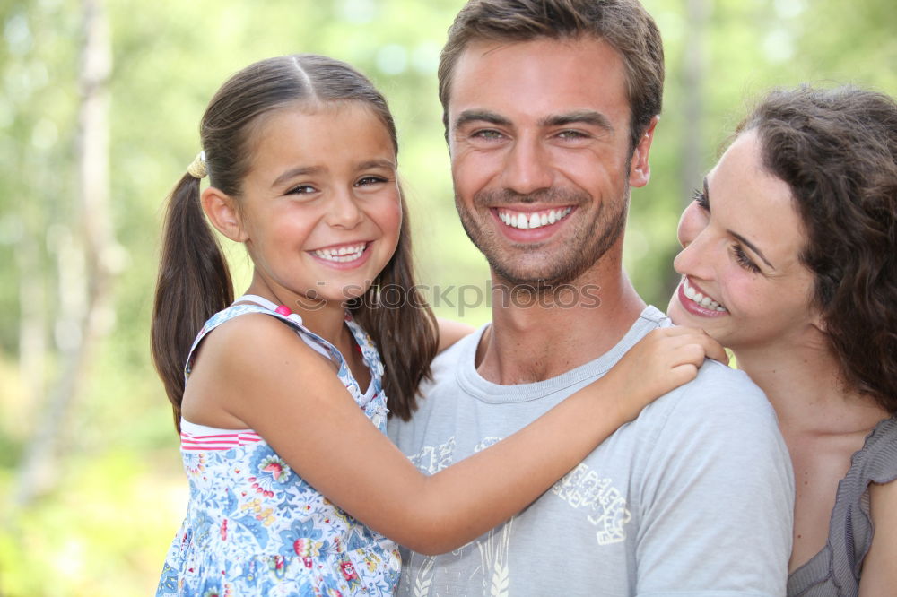 Similar – Image, Stock Photo Happy young family in a urban park.