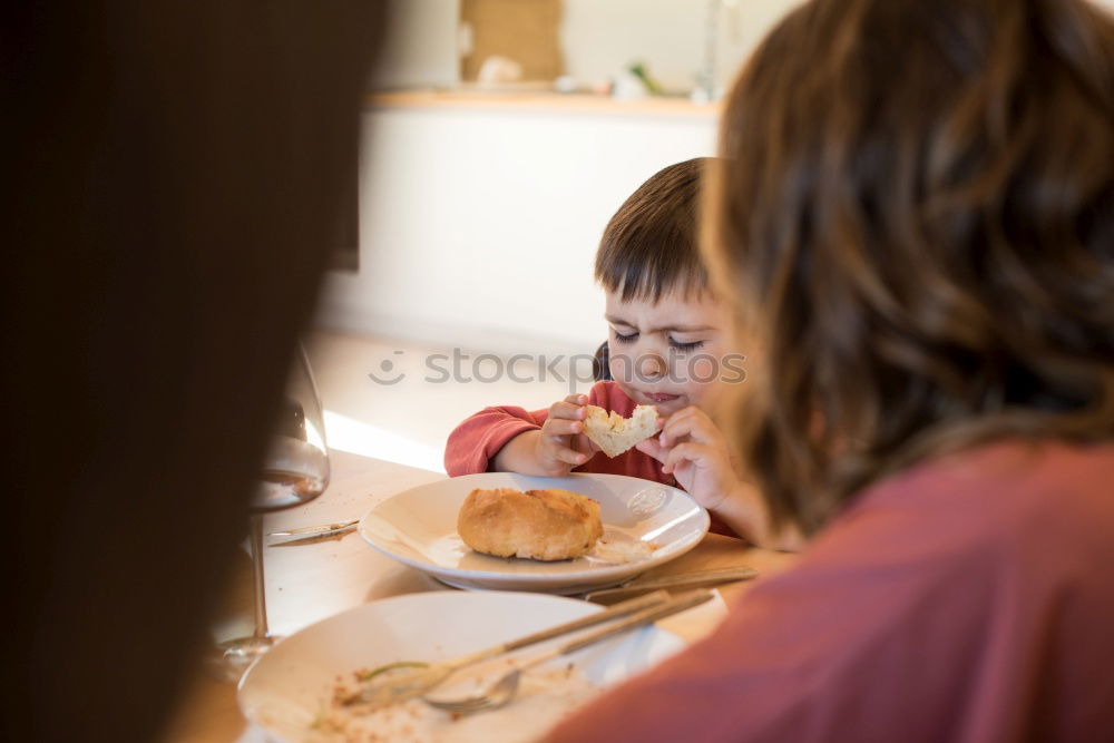 Similar – child girl having breakfast at home