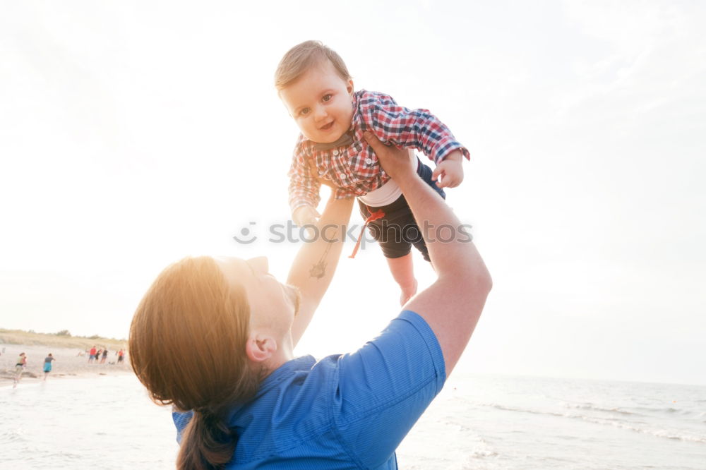 Similar – Image, Stock Photo Happy mother and son having fun on beach on vacation