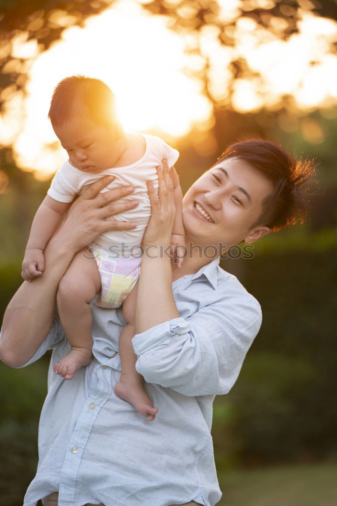 Similar – Happy lesbian couple with child