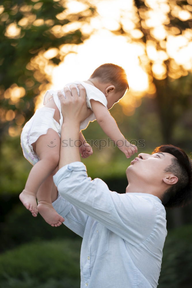 Similar – Father and daughter playing at the park at the day time.