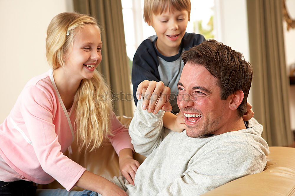 Similar – Happy family in a urban park playing with tablet computer