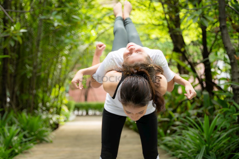 Similar – Image, Stock Photo Two young gymnast girls showing their flexibilty and stretching posing outdoor on a summer day