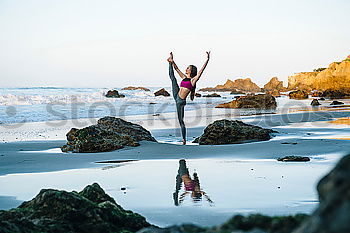 Similar – Image, Stock Photo Young women doing yoga pose on beach in the morning