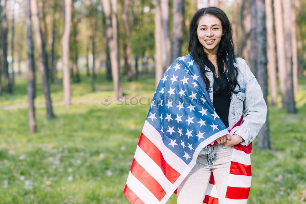 Similar – Teenage girls holding USA flag outdoor