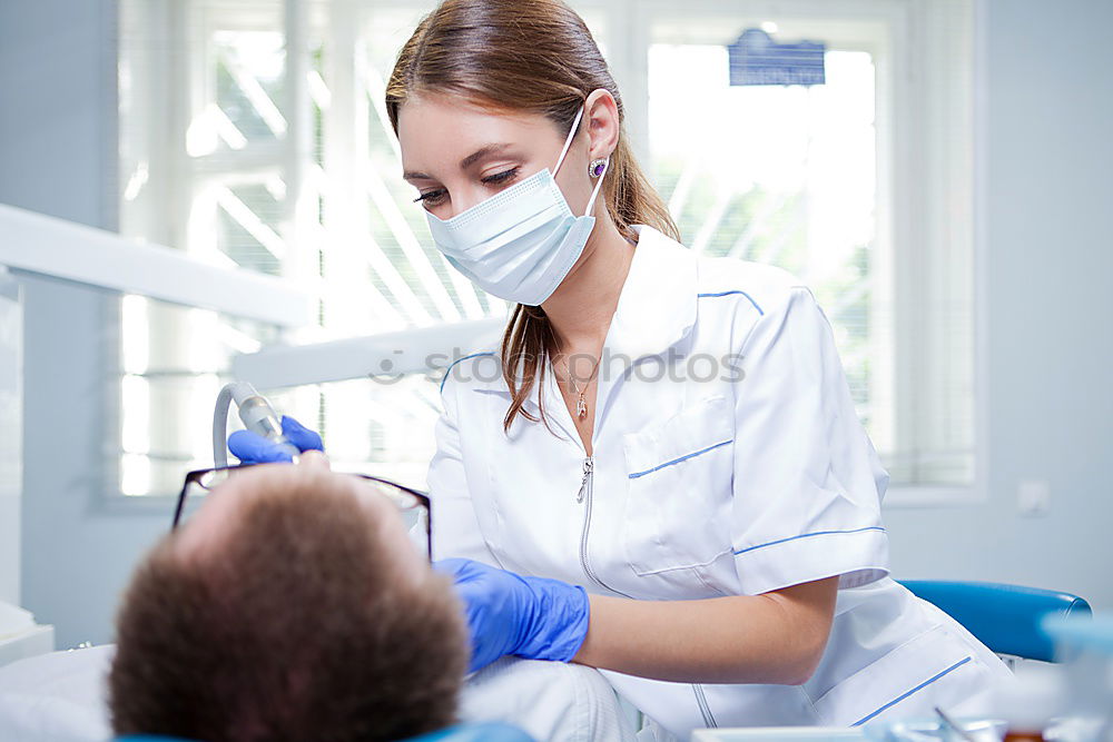 Similar – Doctor holding syringe with vaccine and making injection to senior patient. Covid-19 or coronavirus vaccine