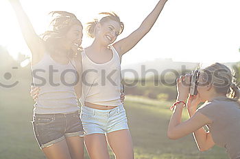 Similar – Women posing in sandy hills