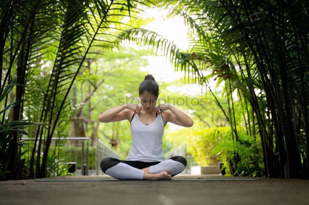 Similar – Young woman meditates in yoga asana Padmasana