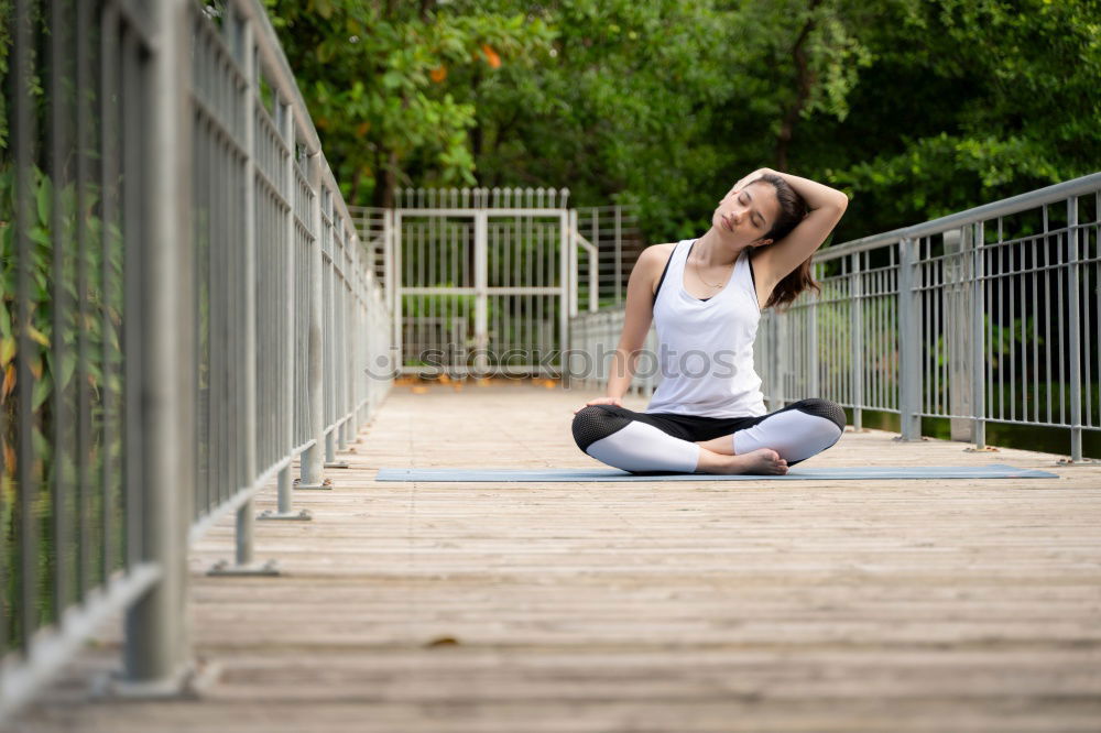 Similar – Image, Stock Photo Young woman doing yoga on wooden road in nature