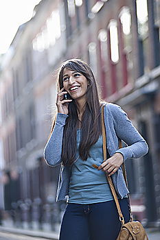 Similar – Image, Stock Photo Portrait of a cheerful young african woman standing outdoors