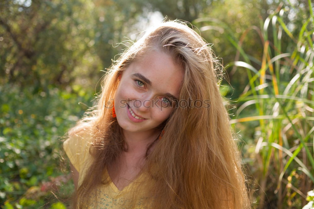 Similar – Pretty happy woman with red long hair