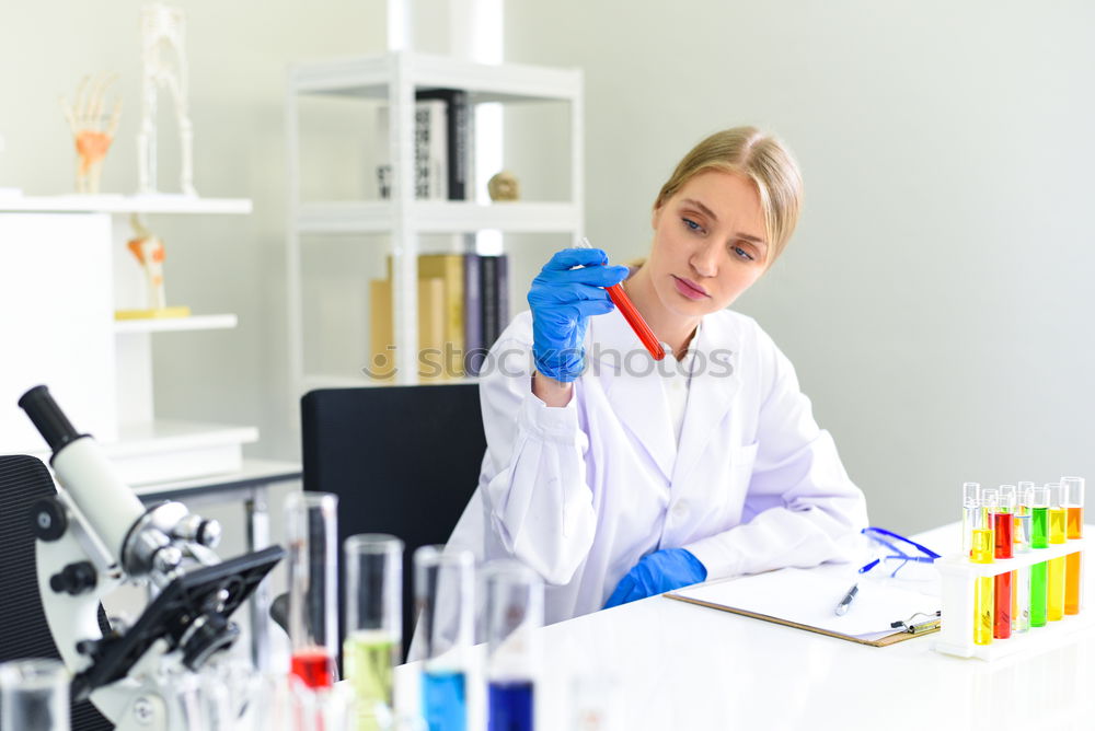 Similar – Image, Stock Photo Woman holding flask in lab