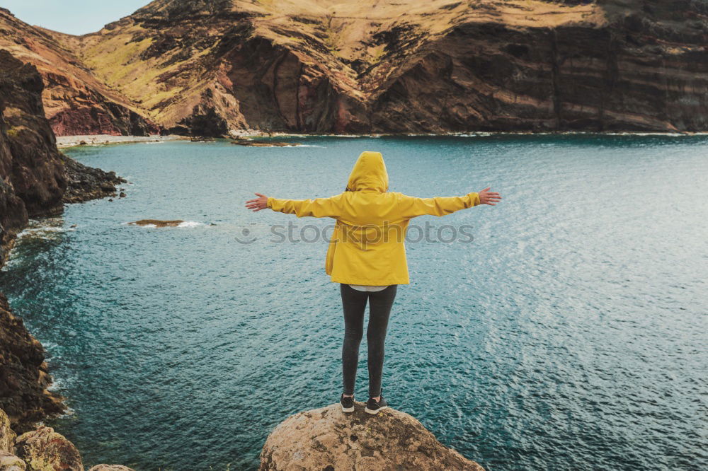 Similar – Tourist jumping over gorge