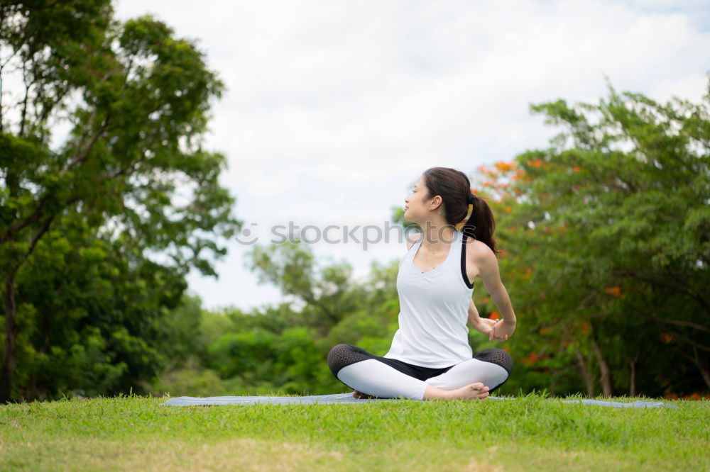 Similar – Image, Stock Photo Young Arab woman doing yoga in nature.