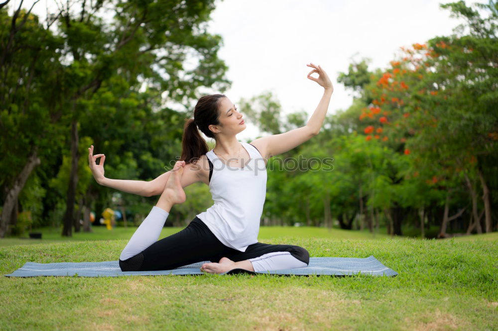 Similar – Young woman meditates in yoga asana Padmasana