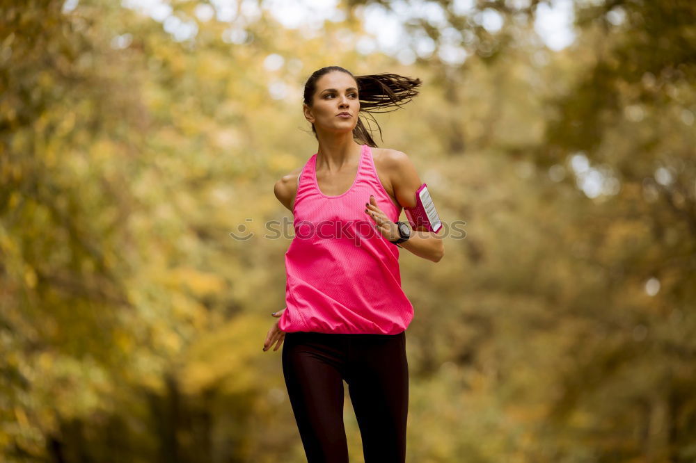 Similar – Fit middle-aged woman walking through a field