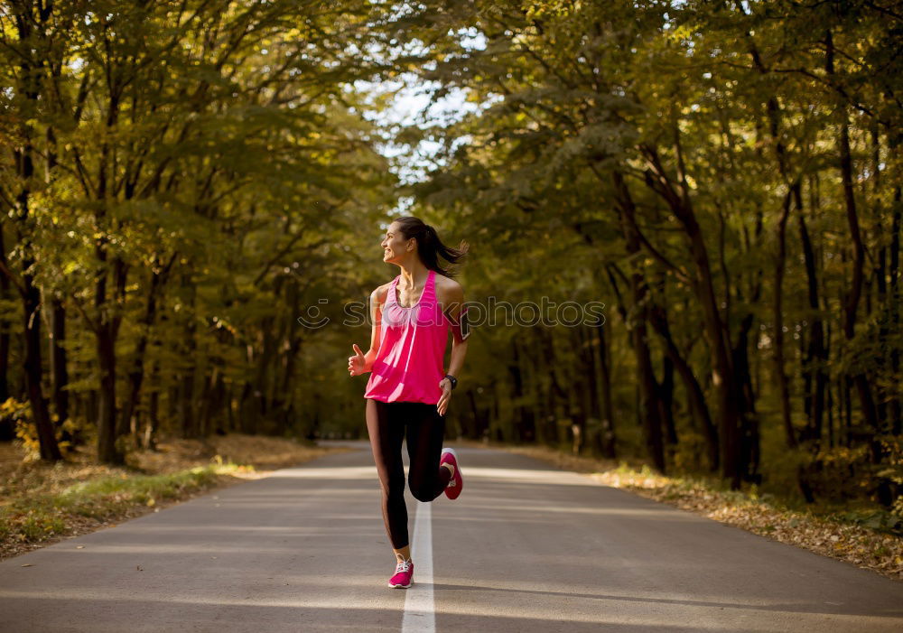 Similar – Fit middle-aged woman walking through a field