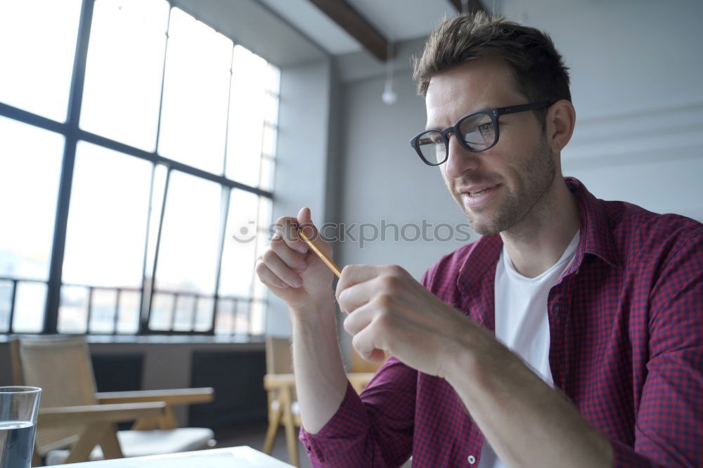 Similar – Bearded man in sunglasses looking at the window