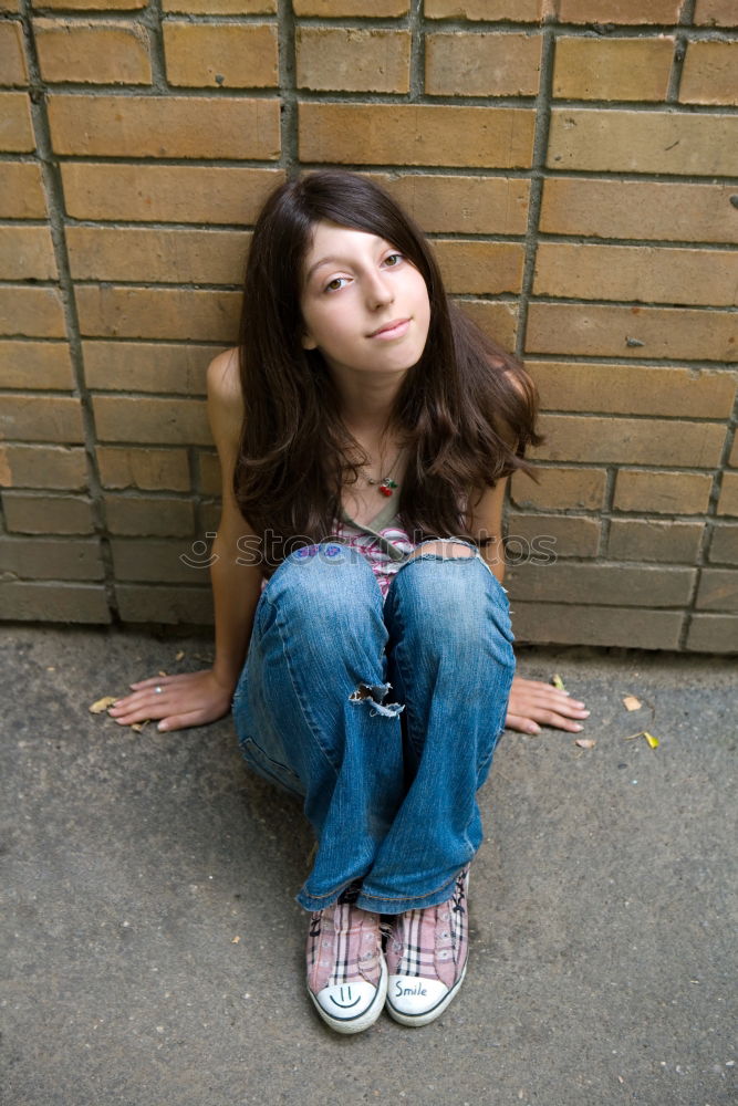 Similar – A young woman sitting on a garden bench