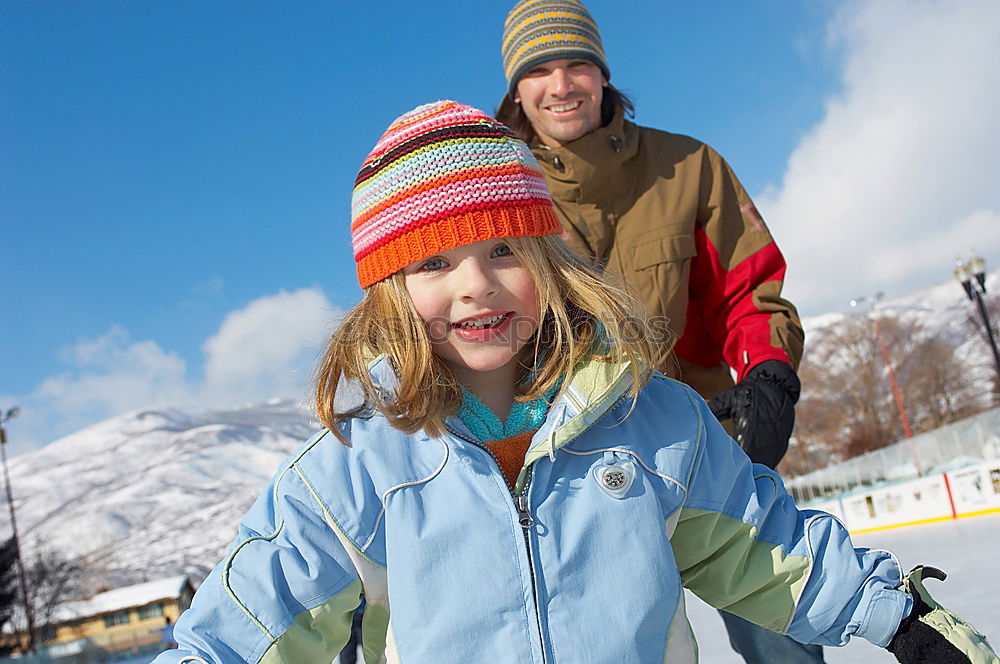 Cute little children playing in snow at a winter day. People having fun outdoors. Concept of Happy new year.