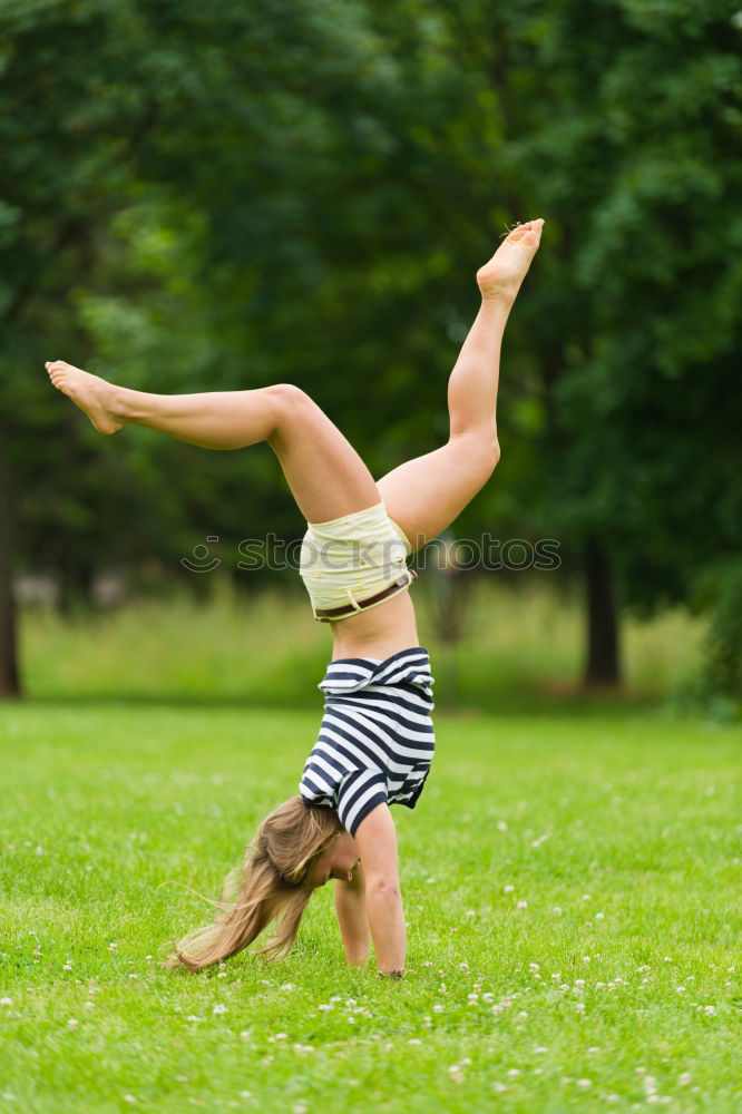 Similar – Image, Stock Photo Girls doing gymnastics and biking in the park ll