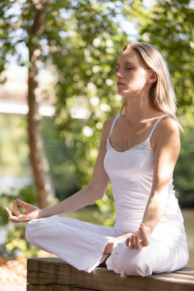 Similar – Woman Meditating And Practicing Yoga, Padmasana.