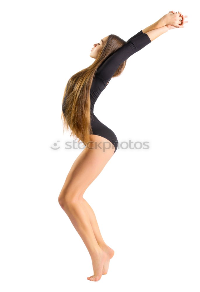 Similar – Teen rhythmic gymnast is holding leg in vertical split doing ribbon exercises.