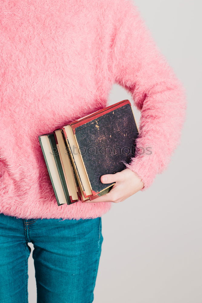 Similar – Image, Stock Photo Young girl turning the pages of book in bookstore