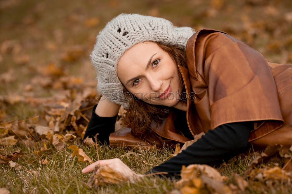 Similar – Young woman in grey sweater is standing in a clearing in the woods