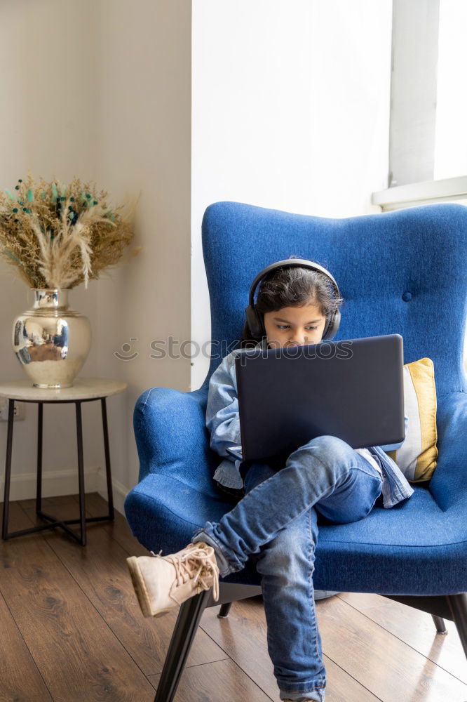 Mother reading a book to her baby son