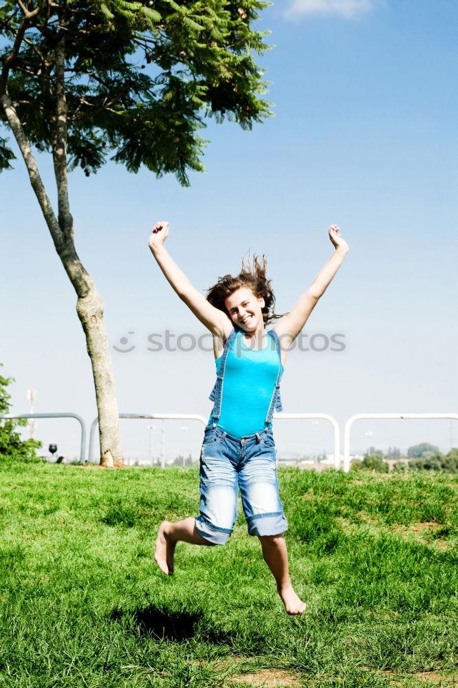 Similar – Low view of a happy redhead woman outdoors